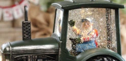 Lighted Green Tractor Water Lantern With Santa In Swirling Glitter 7 Lighted Green Tractor Water Lantern With Santa In Swirling Glitter -King of Christmas tractor close up